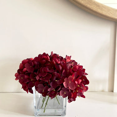 Hydrangea arrangement in cubed glass vase